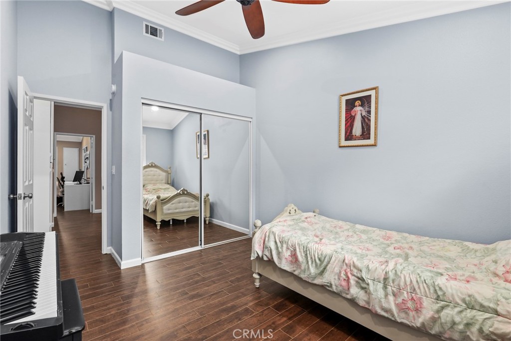 28126 Seco Canyon Road Saugus, CA 91390 - Photo 16 of 30 a bedroom with a bed and wooden floor