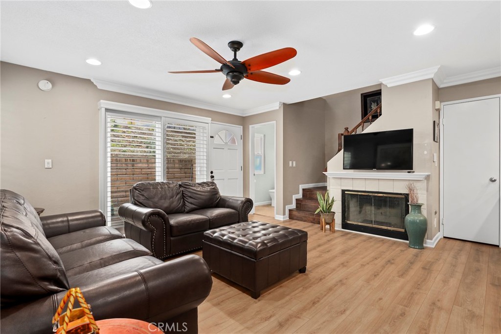 28126 Seco Canyon Road Saugus, CA 91390 - Photo 4 of 30 a living room with furniture a flat screen tv and a fireplace