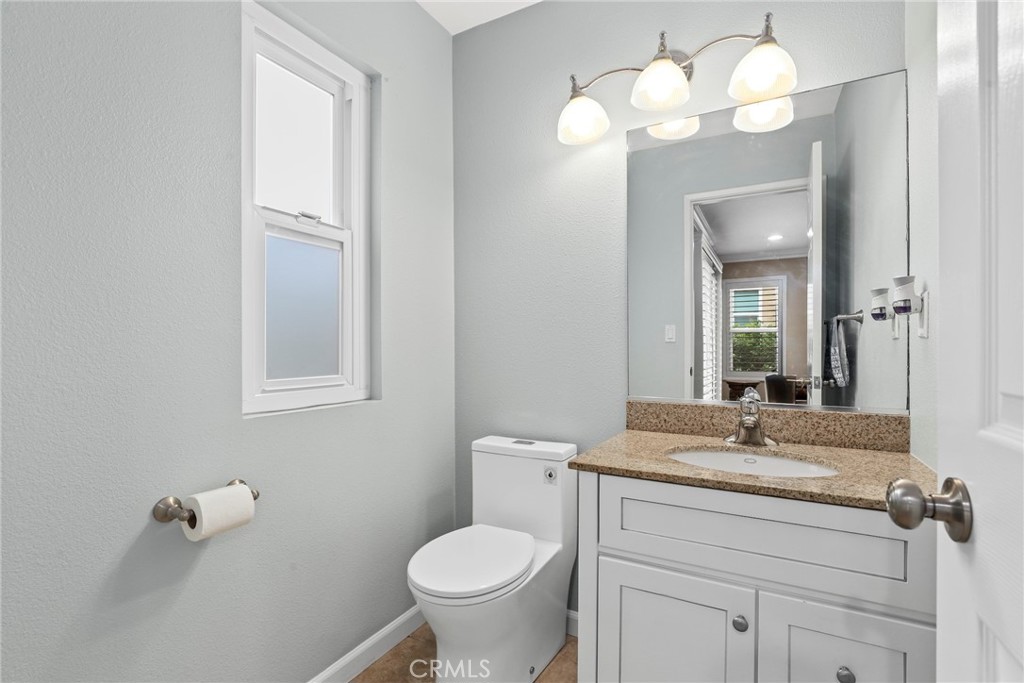 28126 Seco Canyon Road Saugus, CA 91390 - Photo 10 of 30 a bathroom with a toilet sink and mirror