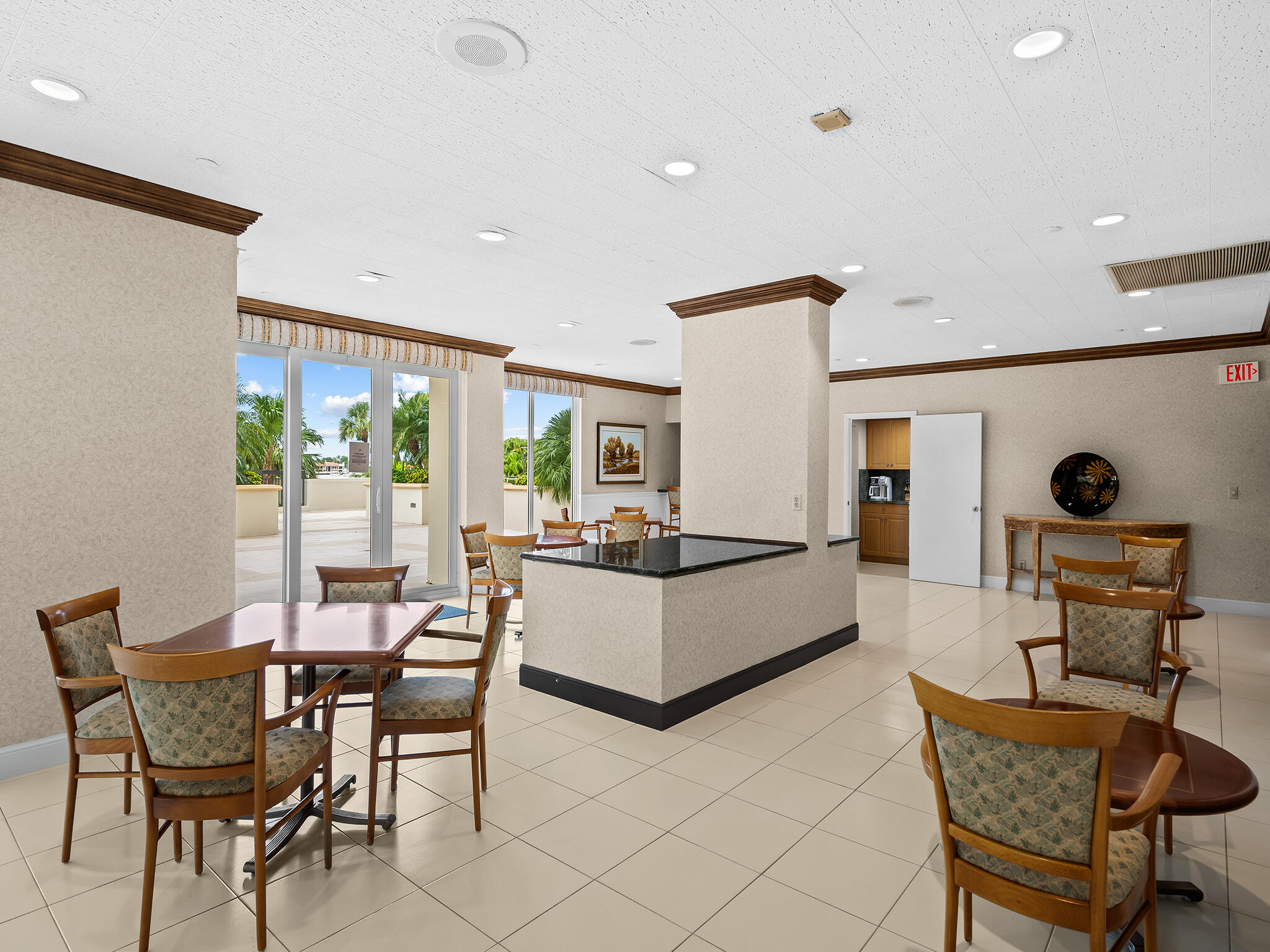 901 East Camino Real, Unit 4D Boca Raton, FL 33432 - Photo 30 of 37 a living room with furniture and a large window