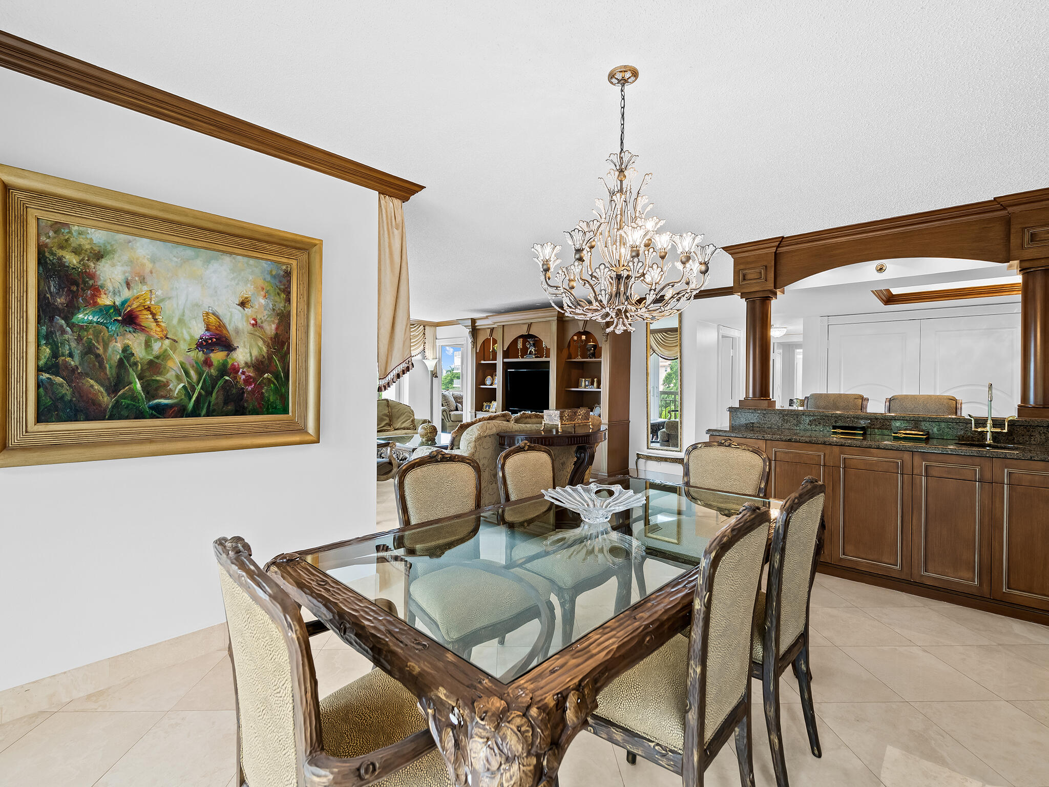 901 East Camino Real, Unit 4D Boca Raton, FL 33432 - Photo 6 of 37 a dining room with furniture and chandelier