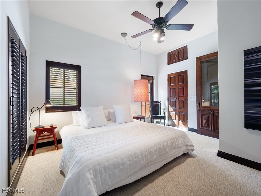 5844 Riverside Lane Fort Myers, FL 33919 - Photo 22 of 50 a bedroom with a bed and a large window