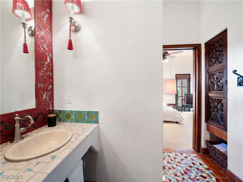 5844 Riverside Lane Fort Myers, FL 33919 - Photo 23 of 50 a bathroom with a sink and a mirror