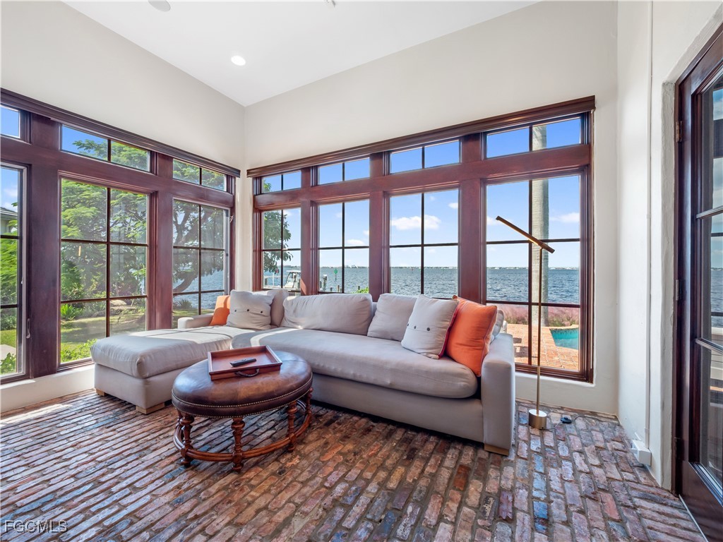 5844 Riverside Lane Fort Myers, FL 33919 - Photo 25 of 50 a living room with furniture and a floor to ceiling window