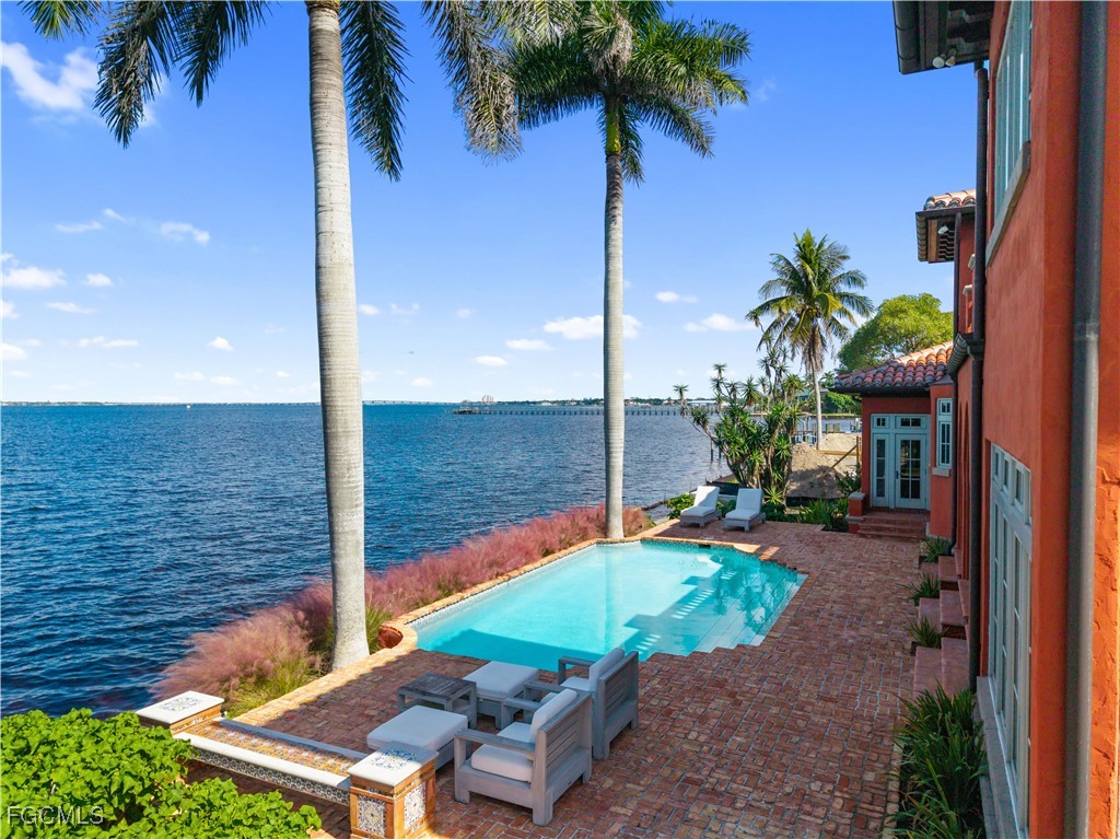 5844 Riverside Lane Fort Myers, FL 33919 - Photo 29 of 50 a view of a backyard with plants and ocean view