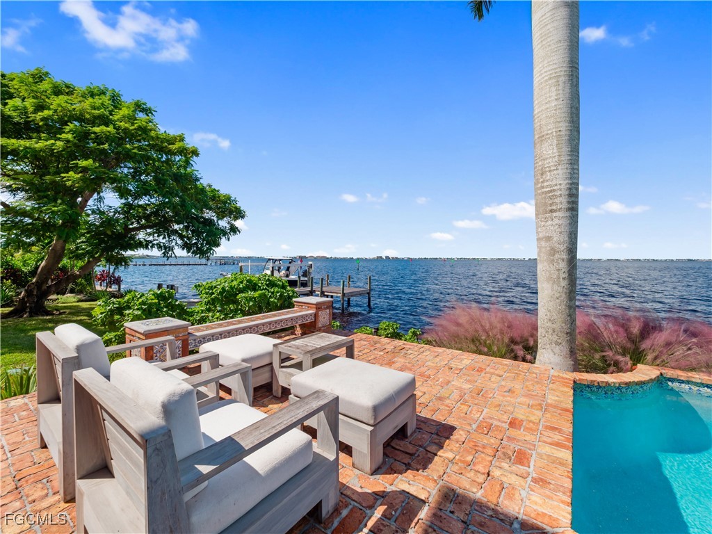 5844 Riverside Lane Fort Myers, FL 33919 - Photo 32 of 50 a view of a roof deck with couches and sky view