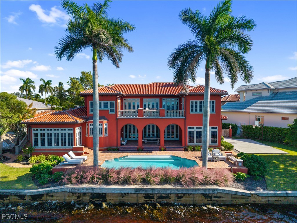 5844 Riverside Lane Fort Myers, FL 33919 - Photo 35 of 50 a street sign under a blue umbrella