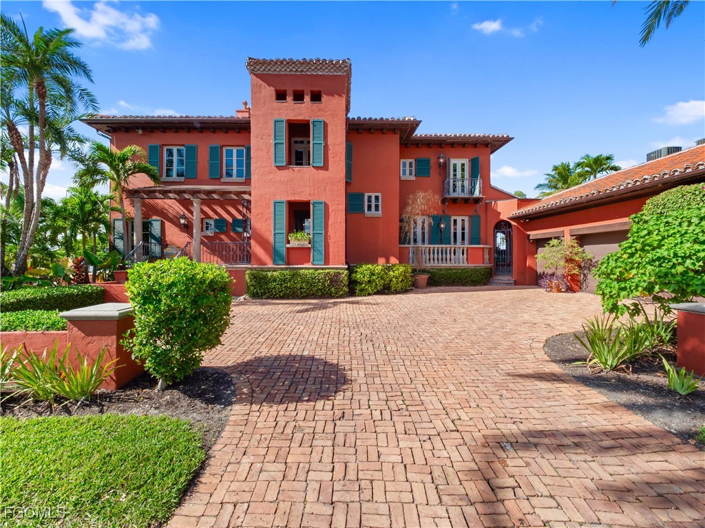 5844 Riverside Lane Fort Myers, FL 33919 - Photo 4 of 50 a front view of a house with a yard