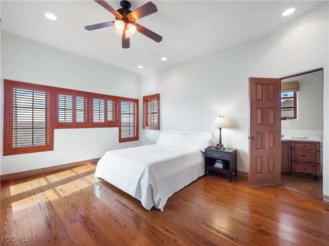 a bathroom with a sink vanity mirror and toilet