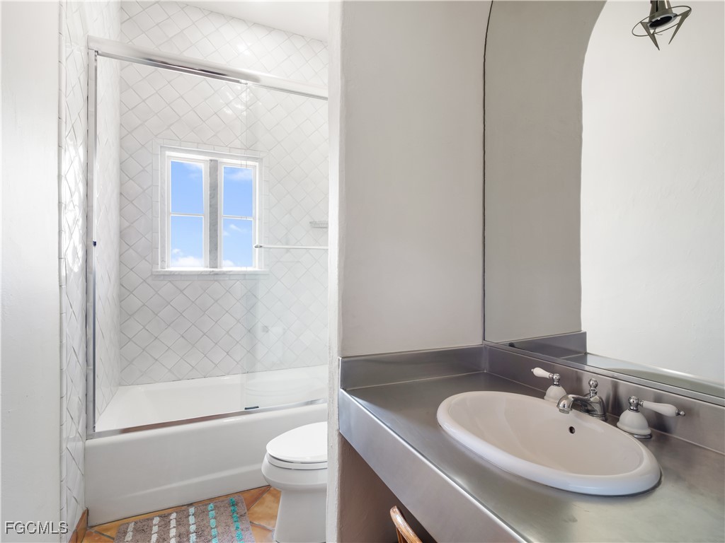 5844 Riverside Lane Fort Myers, FL 33919 - Photo 47 of 50 a bathroom with a sink a toilet and shower