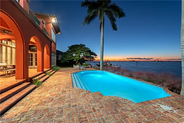 a view of an swimming pool with an outdoor space and seating area