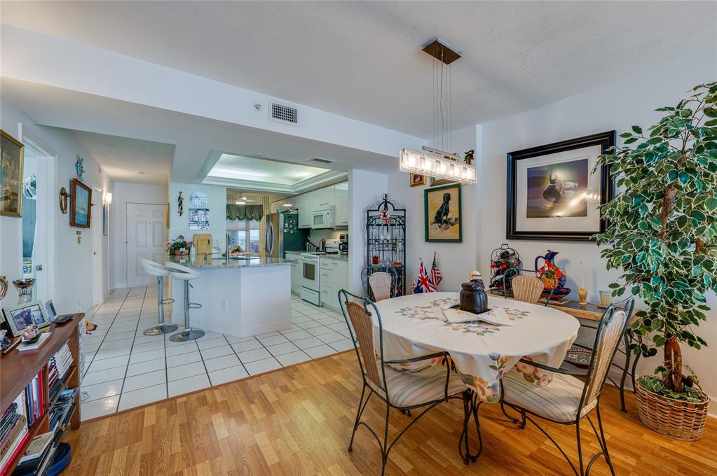 4565 South Atlantic Avenue, Unit 5708 Ponce Inlet, FL 32127 - Photo 13 of 31 a view of a dining room with furniture and chandelier