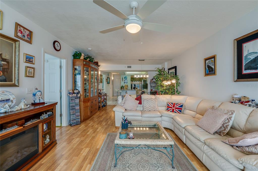 4565 South Atlantic Avenue, Unit 5708 Ponce Inlet, FL 32127 - Photo 15 of 31 a living room with furniture and a flat screen tv