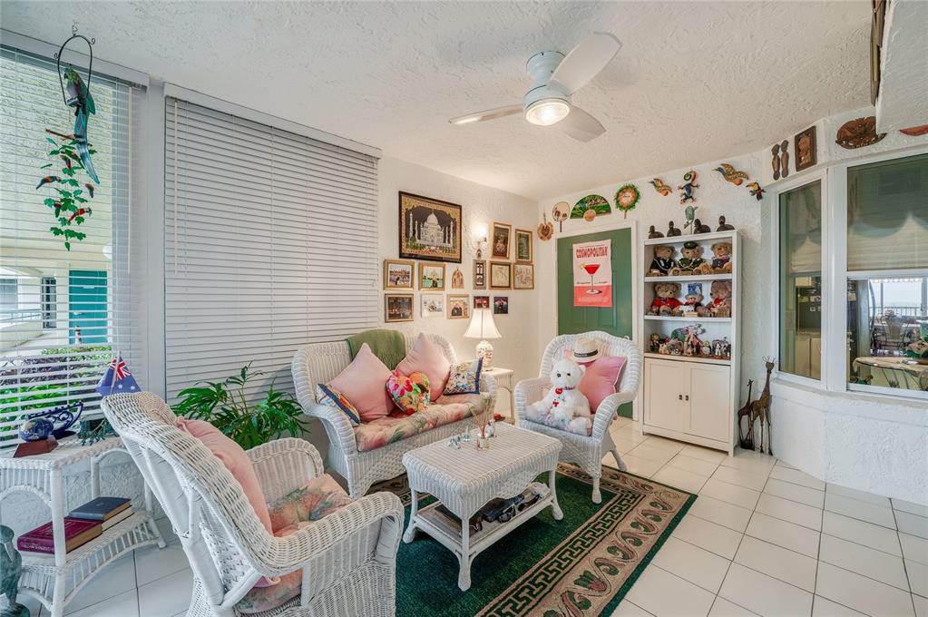 4565 South Atlantic Avenue, Unit 5708 Ponce Inlet, FL 32127 - Photo 2 of 31 a living room with furniture and flowers