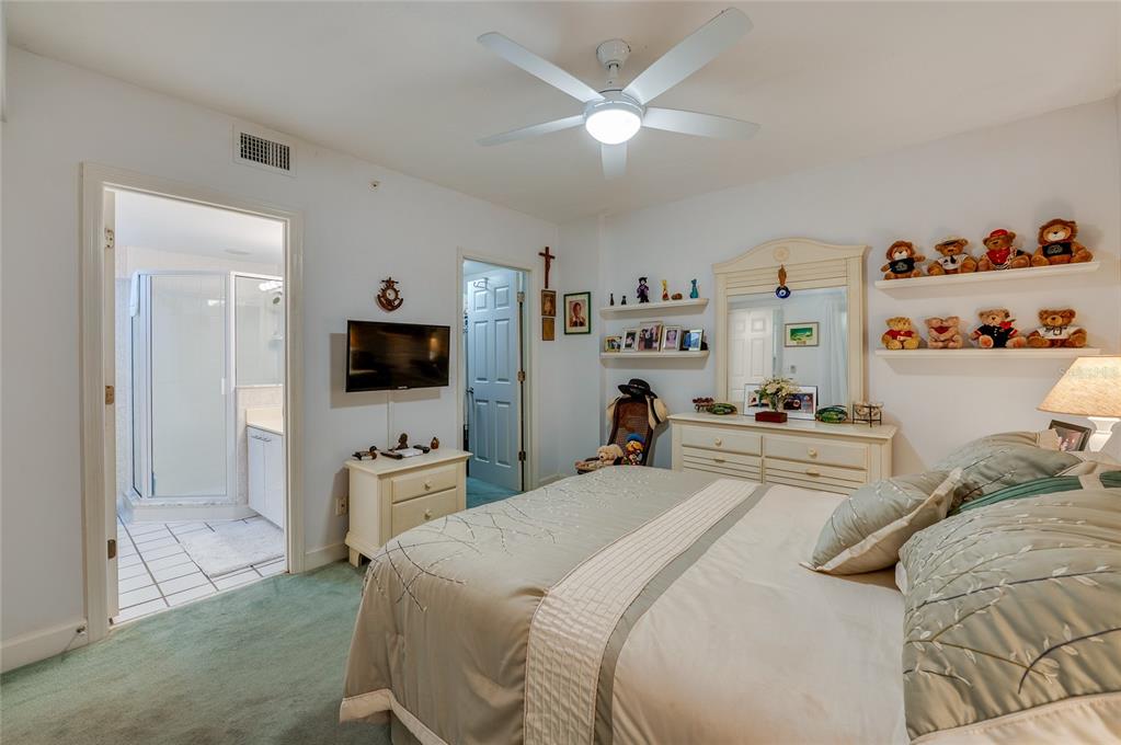 4565 South Atlantic Avenue, Unit 5708 Ponce Inlet, FL 32127 - Photo 22 of 31 a bedroom with a bed and a flat screen tv