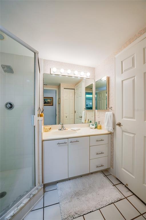 4565 South Atlantic Avenue, Unit 5708 Ponce Inlet, FL 32127 - Photo 23 of 31 a spacious bathroom with a mirror sink and vanity