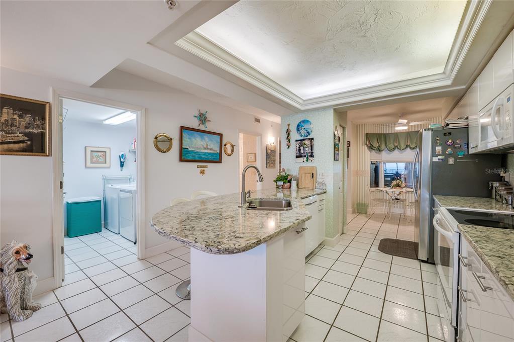 4565 South Atlantic Avenue, Unit 5708 Ponce Inlet, FL 32127 - Photo 5 of 31 a kitchen with a sink and cabinets