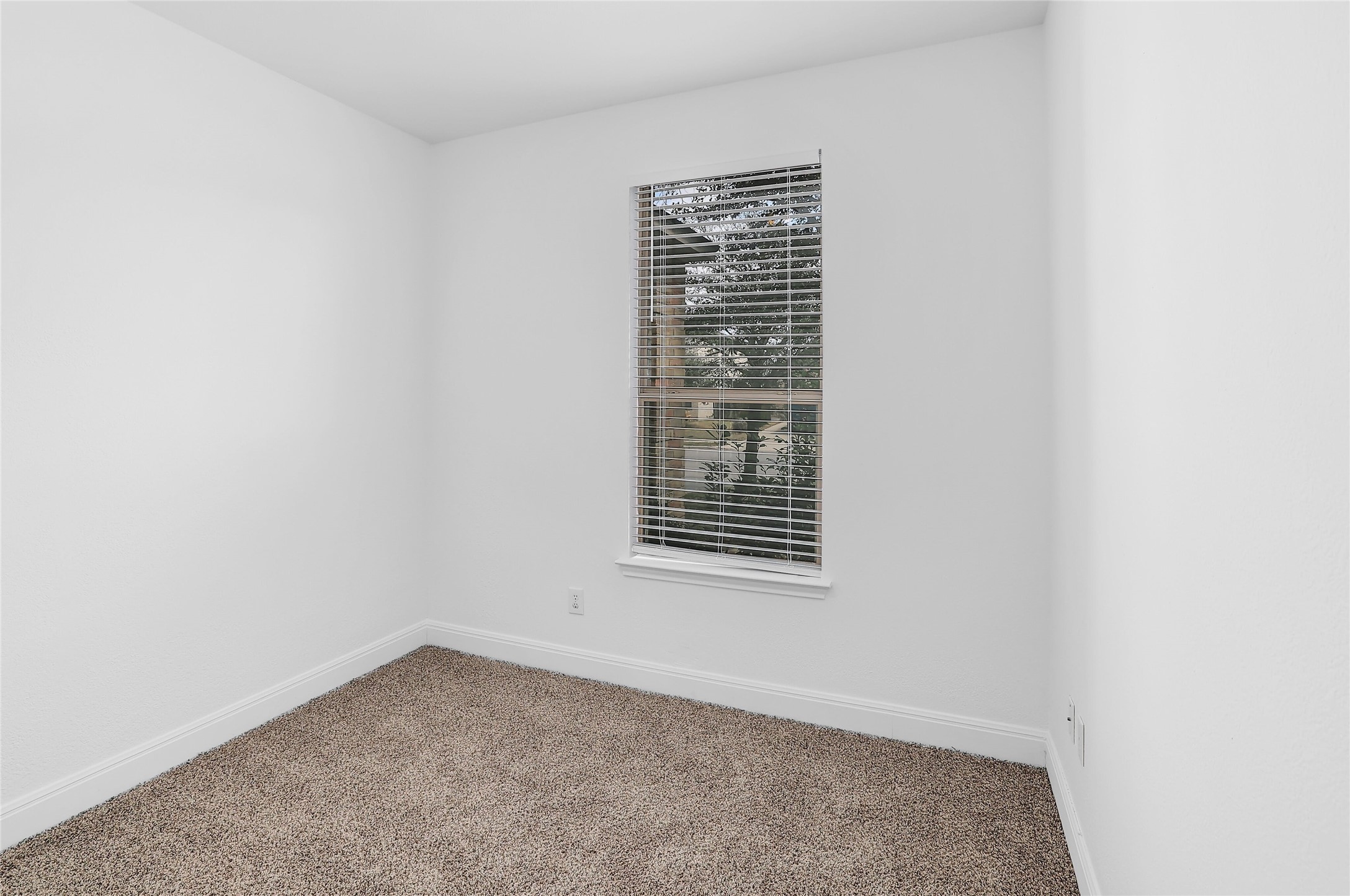 203 Ran Road Leander, TX 78641 - Photo 26 of 31 Plush carpeting and a single window define this versatile interior space.