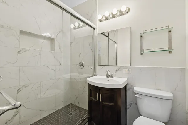 a bedroom with double bed and a couch