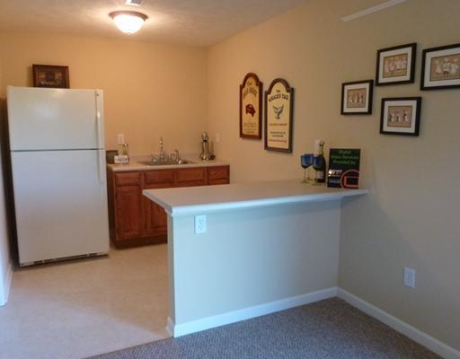 135 Walnut Drive McKees Rocks, PA 15136 - Photo 14 of 18 Den/Family/Great Room. The kitchenette in the lower level equipped with a wet bar, refrigerator and counter to sit. Get ready to mix up your own special concoction for your friends!
