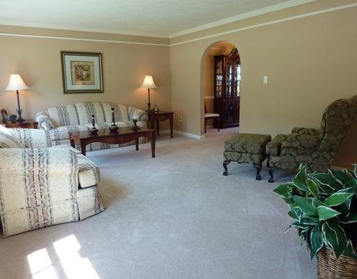 135 Walnut Drive McKees Rocks, PA 15136 - Photo 3 of 18 Living Room. Large living room has large windows for plenty of natural light, crown molding and professionally painted in warm earth tone colors.