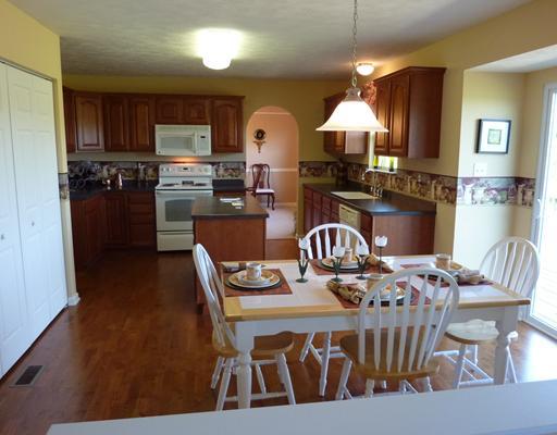 135 Walnut Drive McKees Rocks, PA 15136 - Photo 5 of 18 Kitchen. The large eat-in-kitchen is equipped and ready to bring out the chef anyone! From the rich hardwood floors to the large pantry and convenient island this one screams Ciao to your friends as they enter!