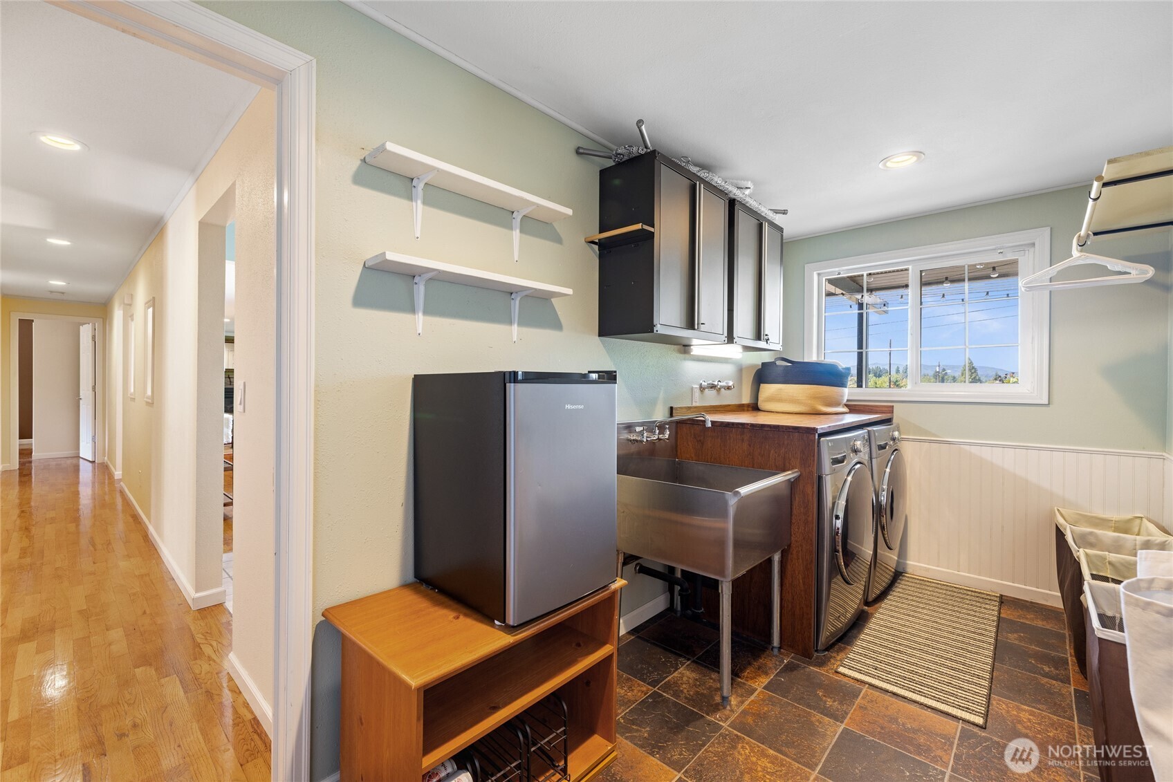 2810 Rickey Road Bremerton, WA 98310 - Photo 25 of 36 a kitchen with stainless steel appliances granite countertop a stove top oven a sink and a refrigerator