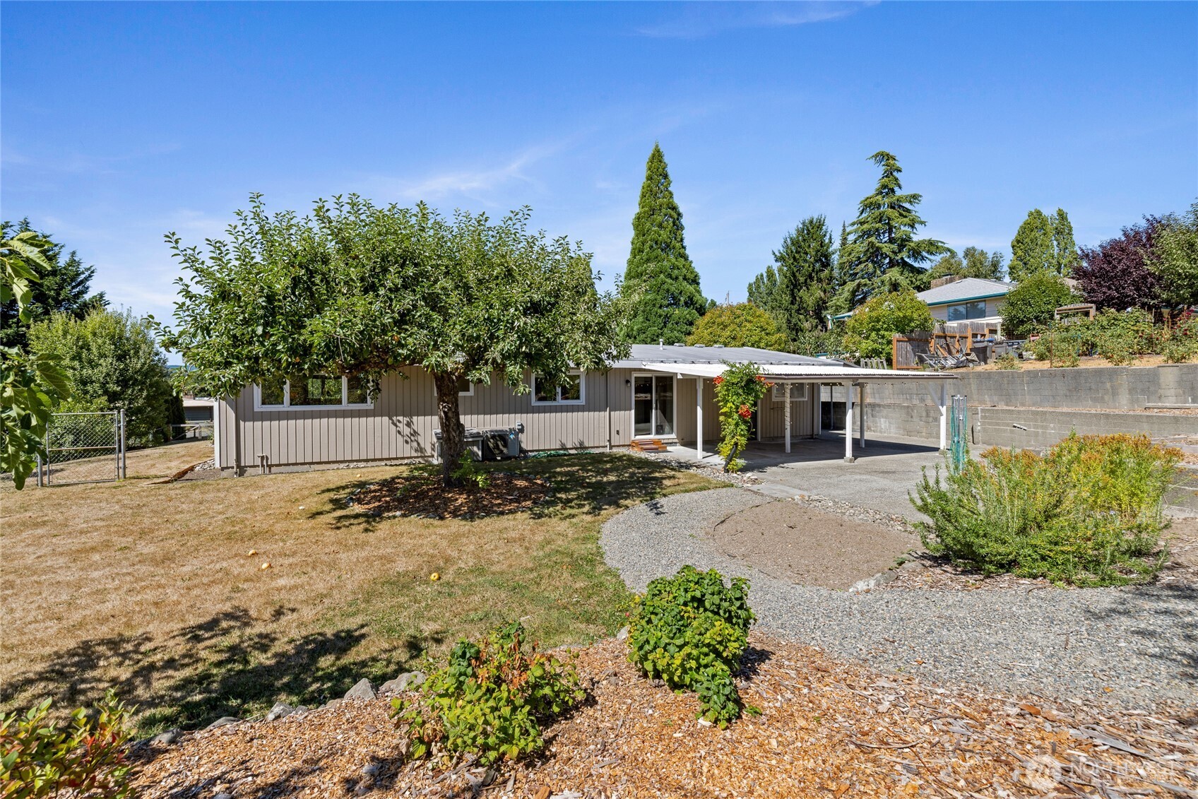 2810 Rickey Road Bremerton, WA 98310 - Photo 29 of 36 a view of a house with a yard and plant in front of it