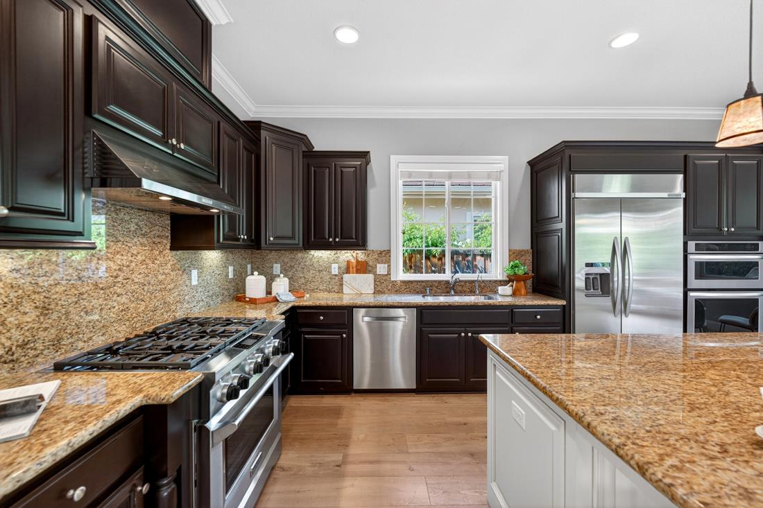 718 Timberpine Avenue Sunnyvale, CA 94086 - Photo 19 of 71 a kitchen with stainless steel appliances granite countertop a stove a sink and a microwave