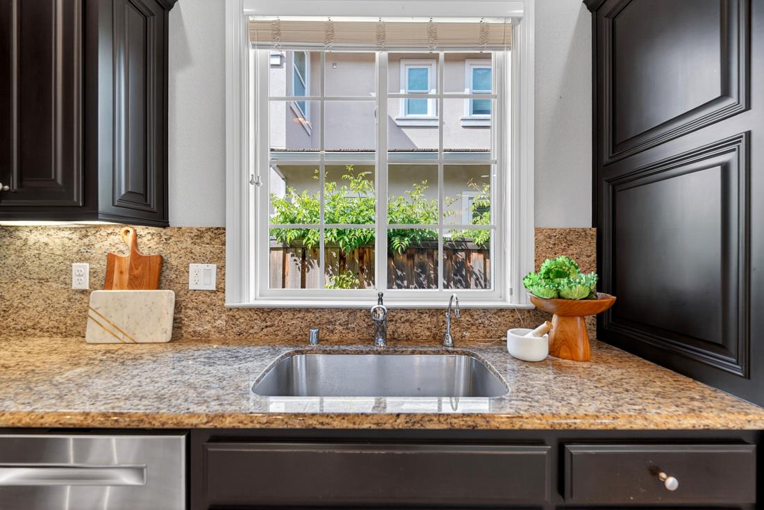 718 Timberpine Avenue Sunnyvale, CA 94086 - Photo 20 of 71 a kitchen with a granite countertop sink and a window