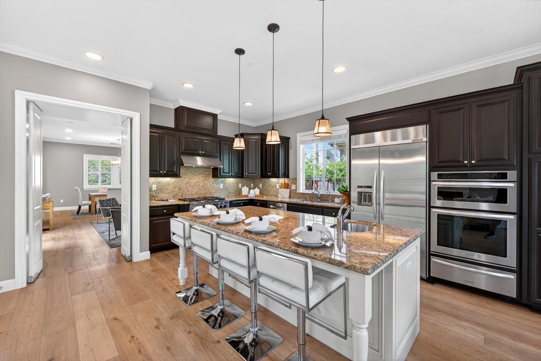 718 Timberpine Avenue Sunnyvale, CA 94086 - Photo 21 of 71 a kitchen with kitchen island a stove a sink a oven a dining table and chairs