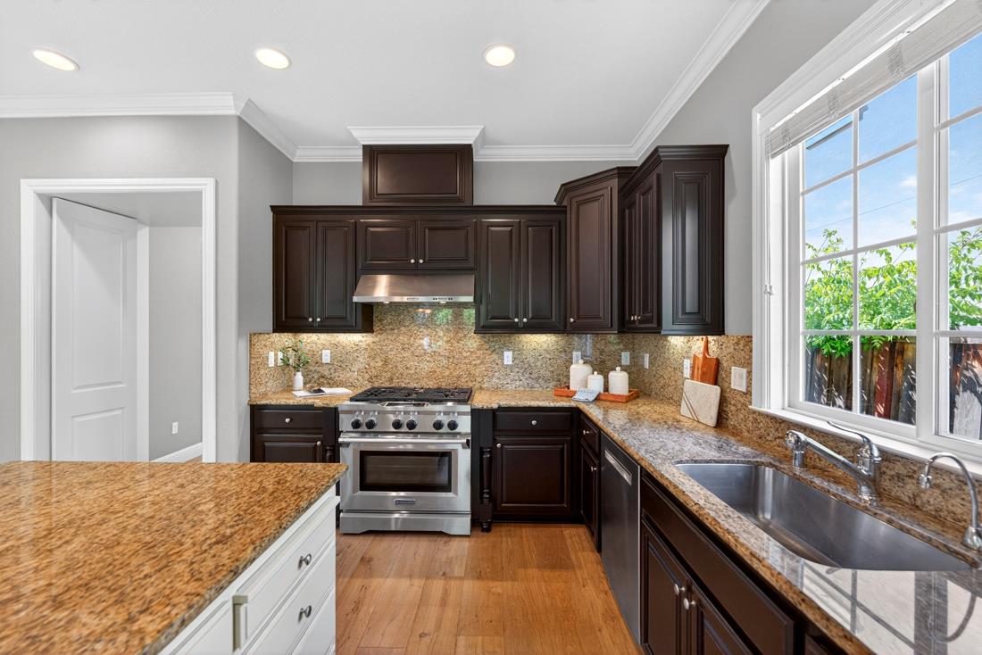 718 Timberpine Avenue Sunnyvale, CA 94086 - Photo 22 of 71 a kitchen with stainless steel appliances granite countertop a sink stove and refrigerator