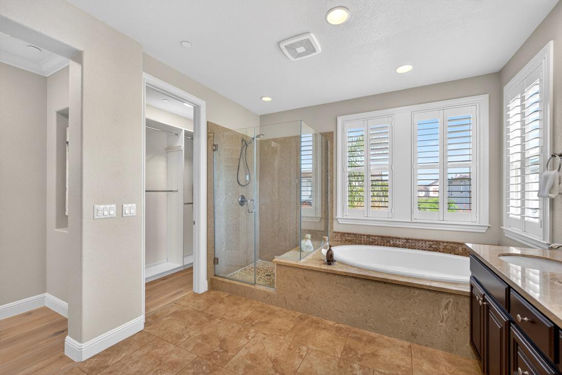 718 Timberpine Avenue Sunnyvale, CA 94086 - Photo 46 of 71 a spacious bathroom with a tub a sink and a large mirror