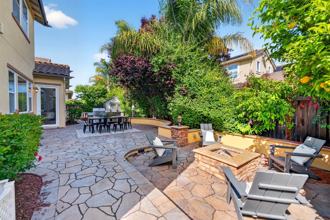 718 Timberpine Avenue Sunnyvale, CA 94086 - Photo 52 of 71 a view of a patio with table and chairs and potted plants