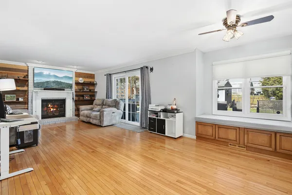 a living room with furniture and a fireplace