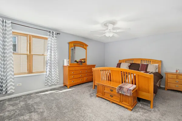a bedroom with furniture and window
