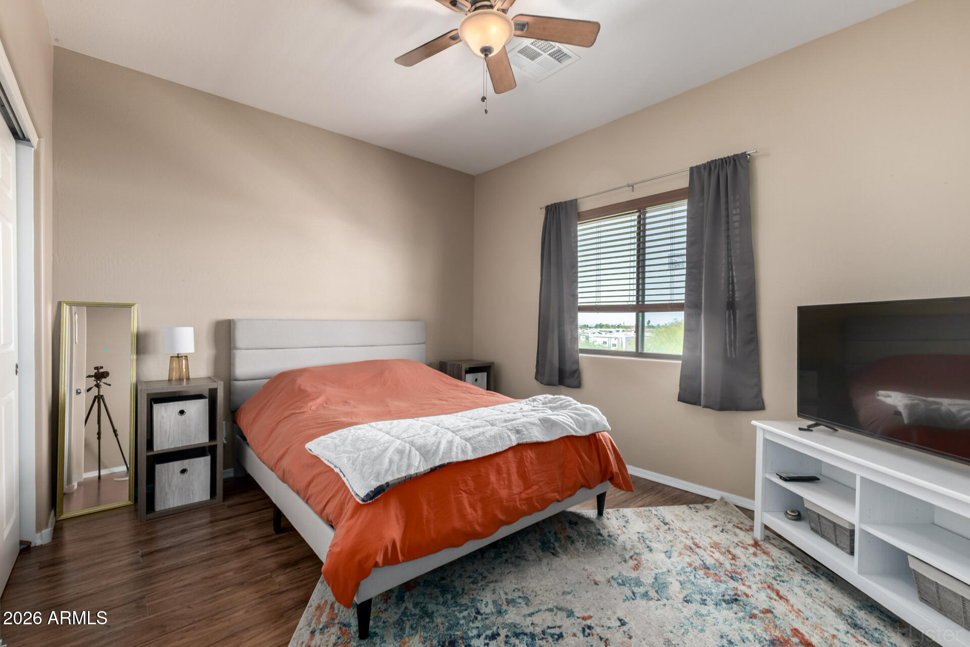 2756 South Powell Road Apache Junction, AZ 85119 - Photo 19 of 37 a bedroom with a bed and a flat screen tv