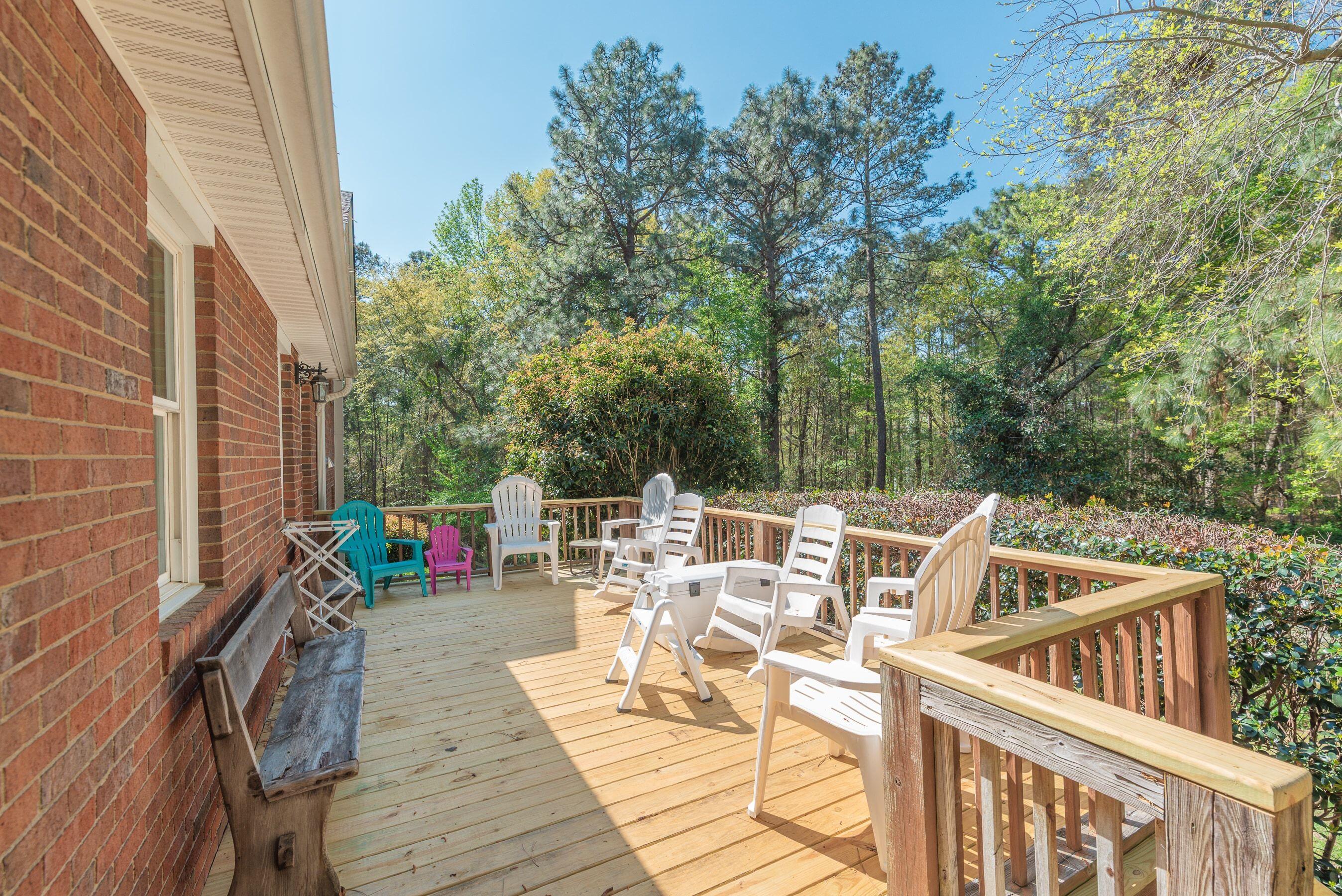 1117 Ridgemont Drive Aiken, SC 29803 - Photo 36 of 49 a view of a patio with table and chairs with wooden floor and fence