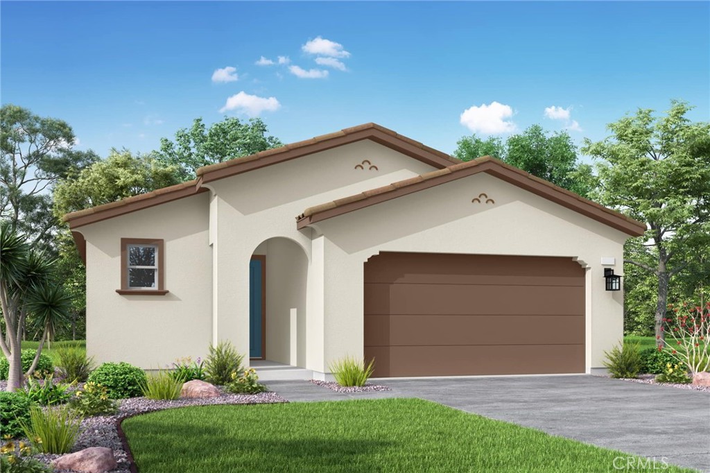 5223 Raintree Place Banning, CA 92220 - Photo 1 of 2 a front view of a house with a yard and garage