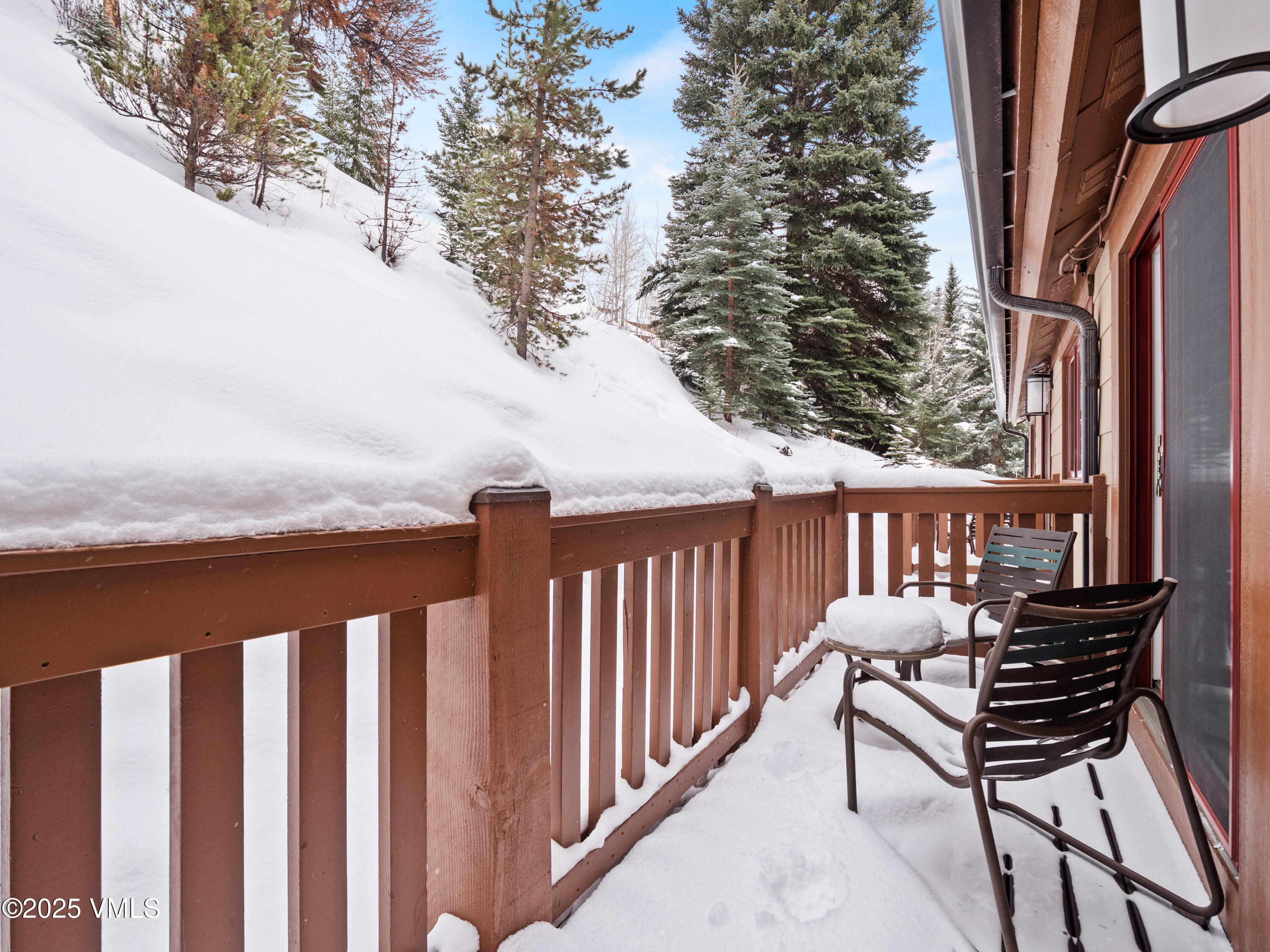 2254 South Frontage Road West, Unit 106/WEEK 51 Vail, CO 81657 - Photo 11 of 15 a view of balcony with wooden floor and outdoor seating