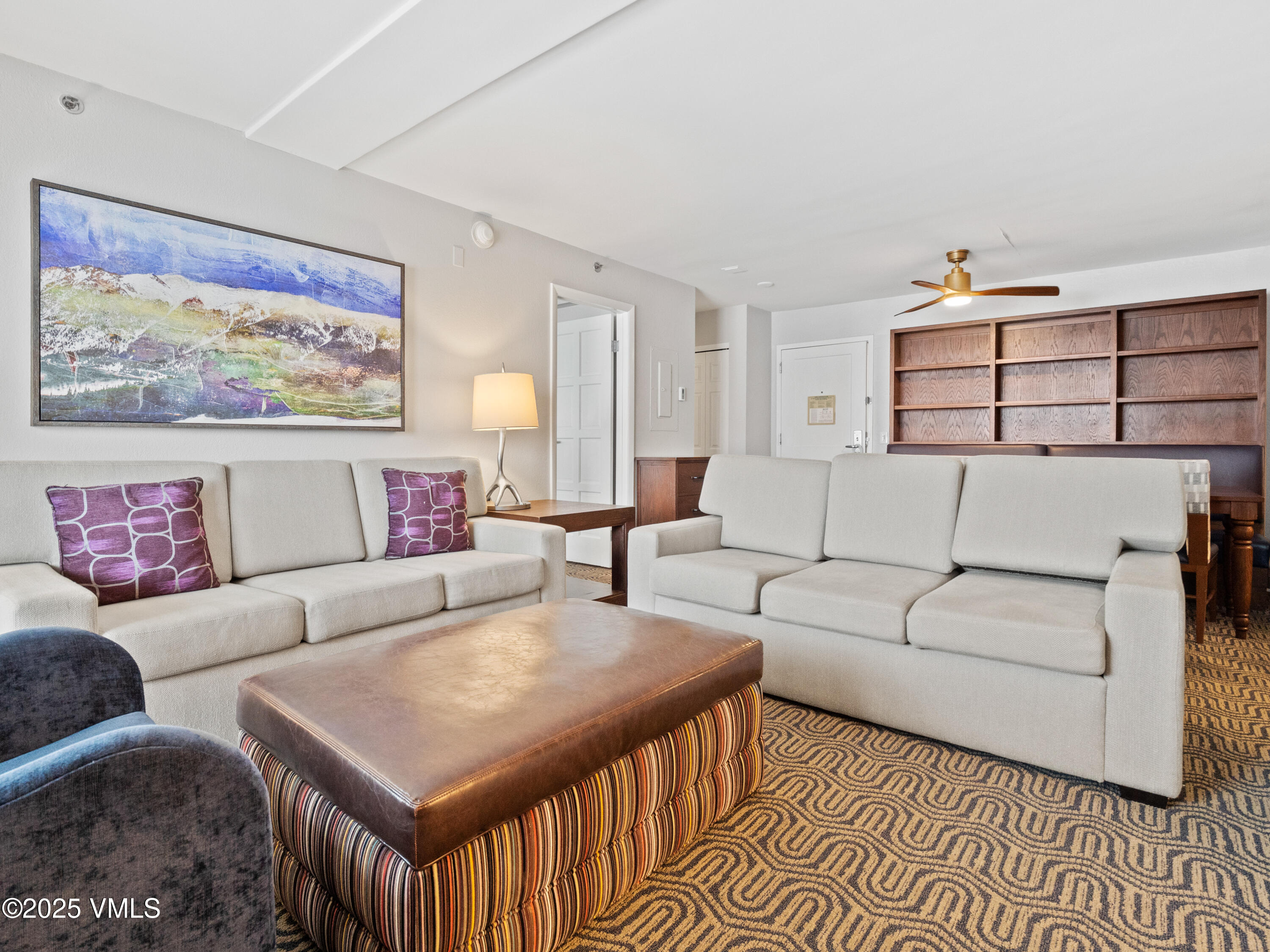 2254 South Frontage Road West, Unit 106/WEEK 51 Vail, CO 81657 - Photo 2 of 15 a living room with furniture and wall painting
