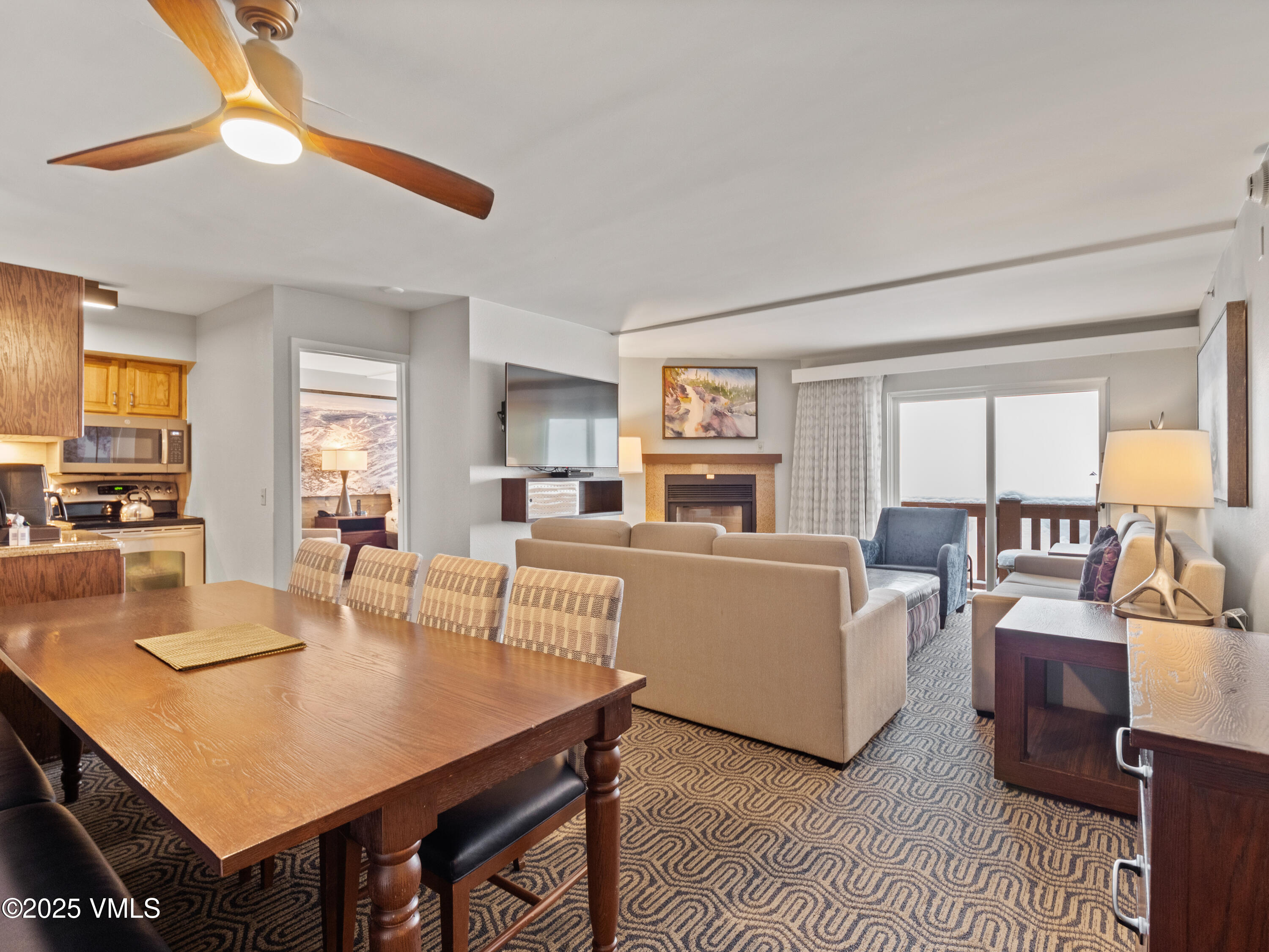2254 South Frontage Road West, Unit 106/WEEK 51 Vail, CO 81657 - Photo 8 of 15 a living room with furniture and a large window