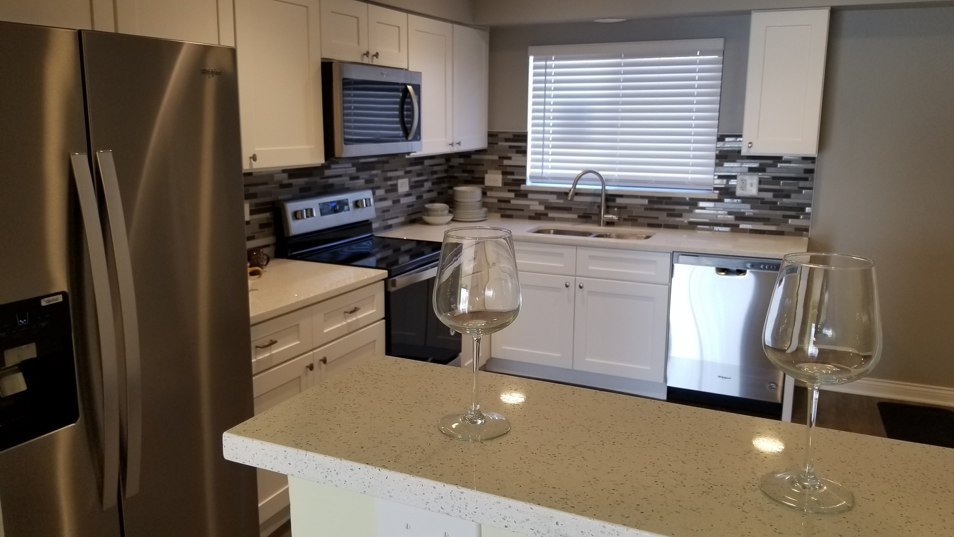 406 East Kensington Road, Unit C Mount Prospect, IL 60056 - Photo 4 of 22 a kitchen with stainless steel appliances a refrigerator sink and stove