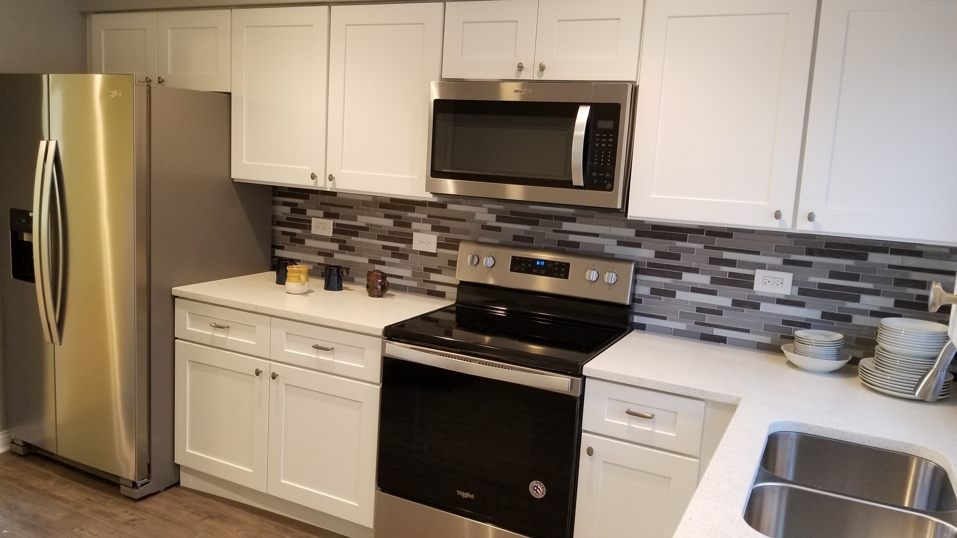 406 East Kensington Road, Unit C Mount Prospect, IL 60056 - Photo 5 of 22 a kitchen with a stove and a microwave