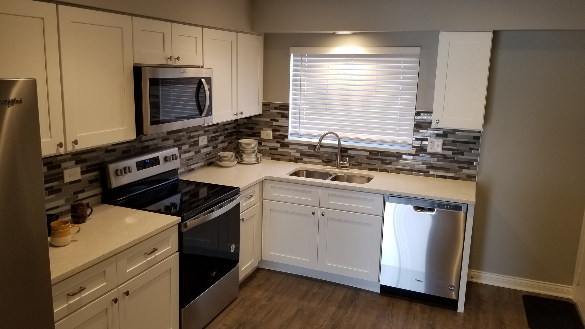 406 East Kensington Road, Unit C Mount Prospect, IL 60056 - Photo 6 of 22 a kitchen with a sink stove and microwave