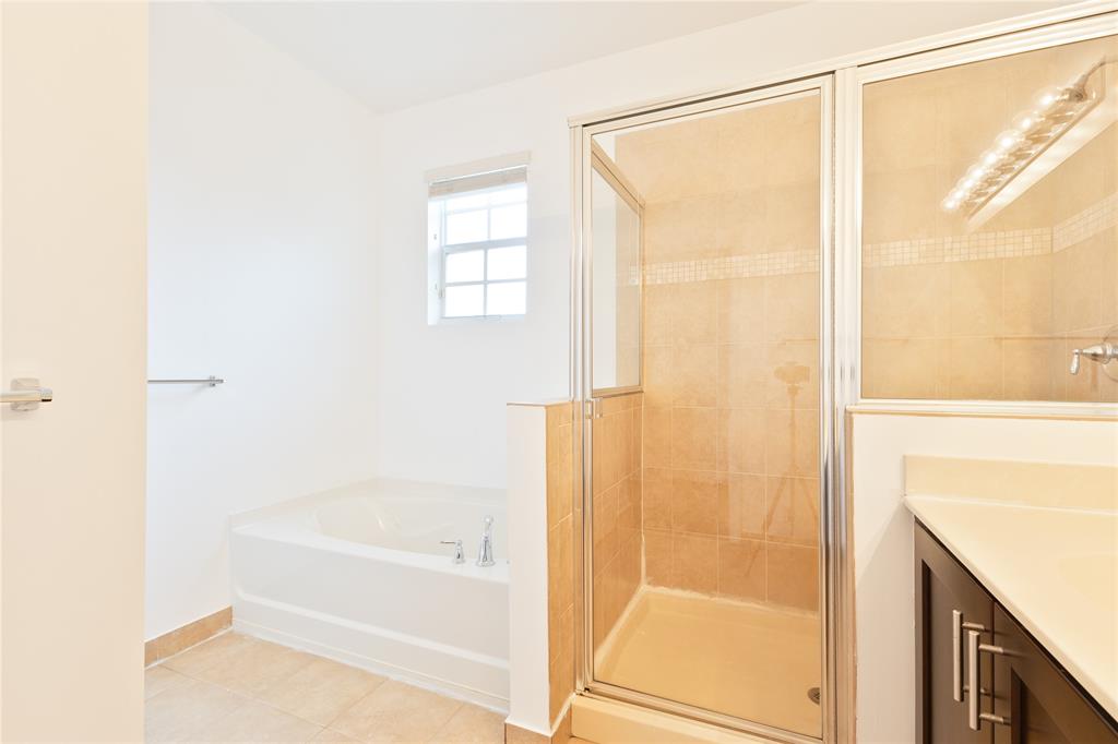 122 Southwest 7th Court, Unit 122 Pompano Beach, FL 33060 - Photo 12 of 36 a bathroom with a bathtub and a shower