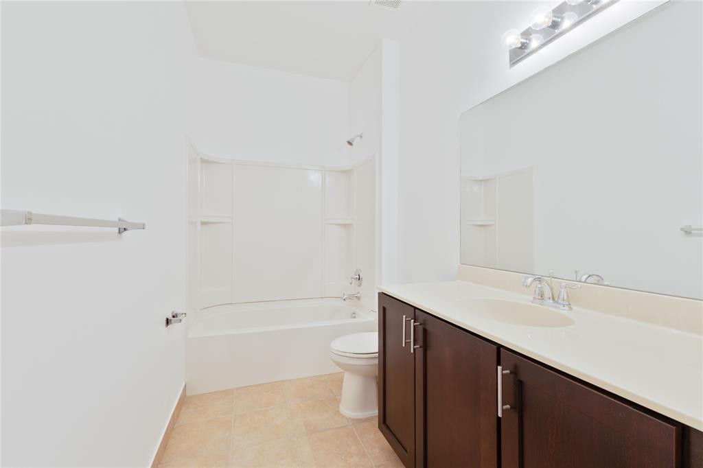 122 Southwest 7th Court, Unit 122 Pompano Beach, FL 33060 - Photo 18 of 36 a bathroom with a sink a toilet and shower