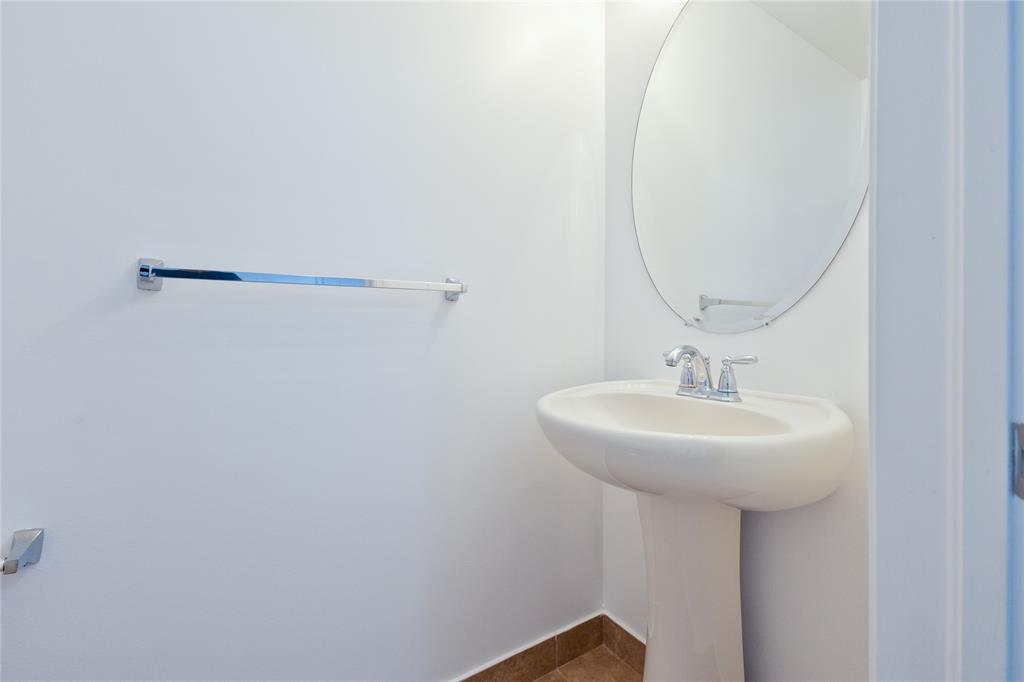 122 Southwest 7th Court, Unit 122 Pompano Beach, FL 33060 - Photo 19 of 36 a bathroom with a sink a mirror and shower