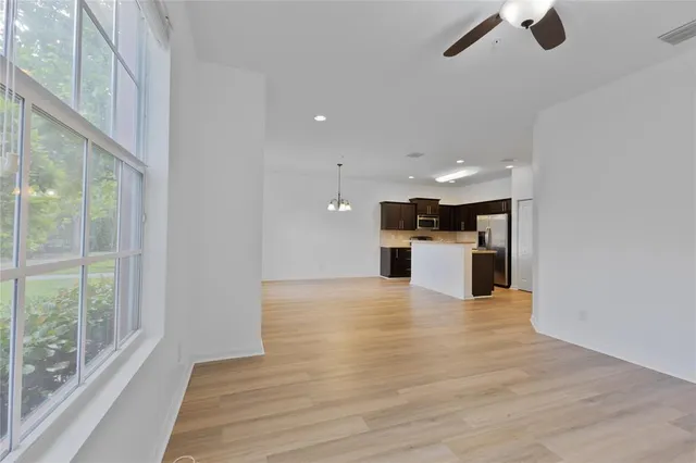 a view of a kitchen with a sink and dishwasher cabinets