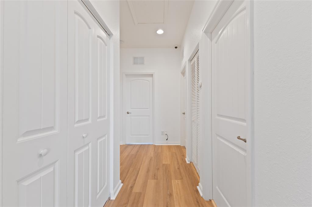 122 Southwest 7th Court, Unit 122 Pompano Beach, FL 33060 - Photo 24 of 36 a view of a hallway with wooden floor and entryway
